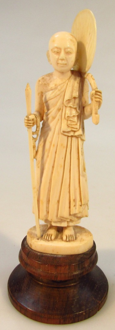 Appraisal: A thC Burmese ivory figure of a Buddhist monk in