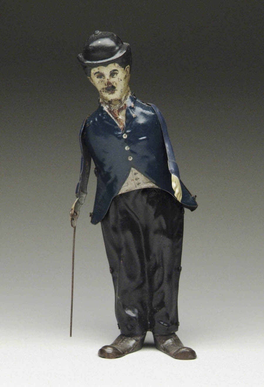 Appraisal: WINDUP WALKING CHARLIE CHAPLIN Lithographed German tin toy with blue