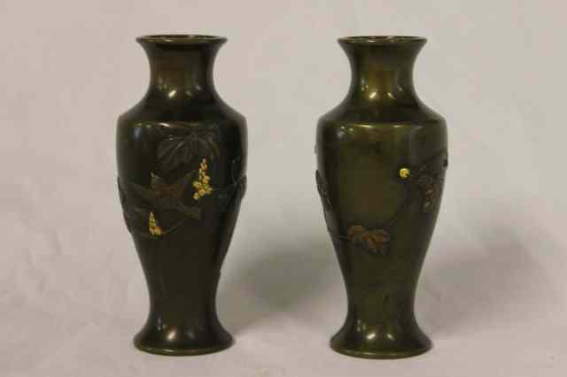 Appraisal: A PAIR OF JAPANESE BRONZE AND SHAKUDO SMALL BALUSTER VASES