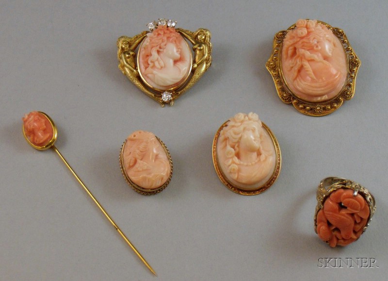 Appraisal: Group of Carved Coral Jewelry including four gold-framed cameo brooches