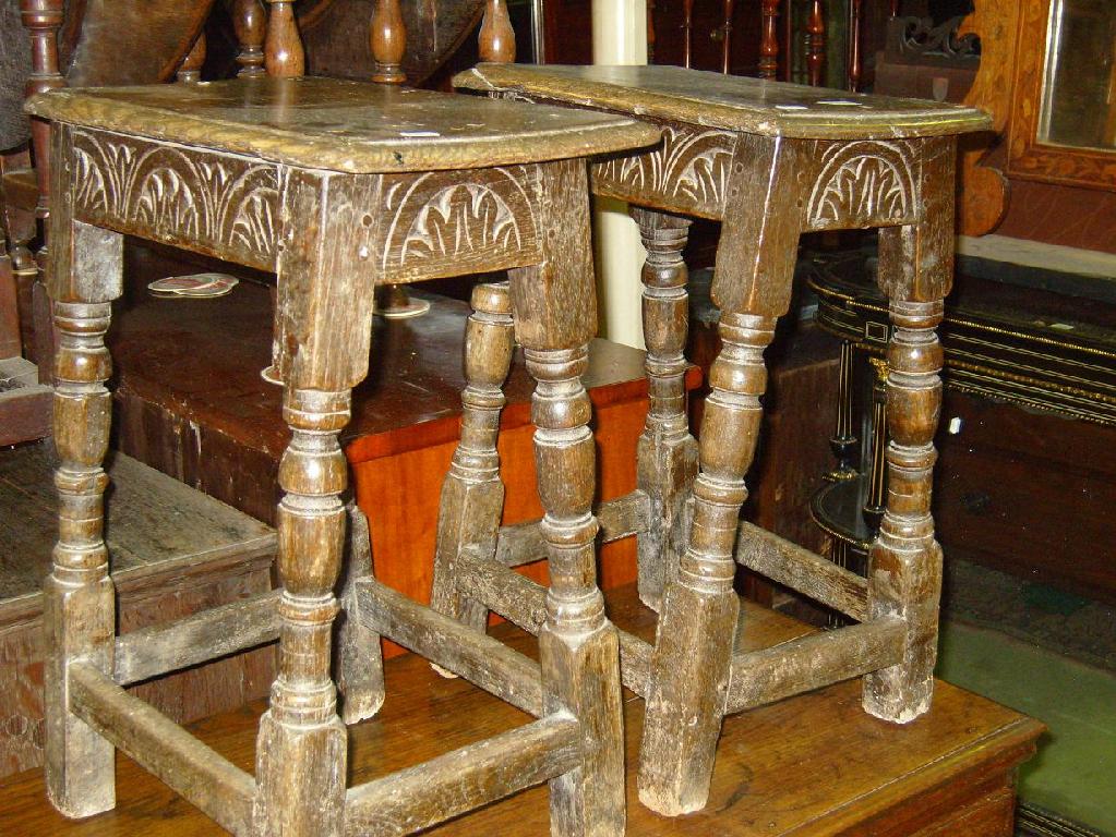 Appraisal: A pair of th century oak coffin stools with carved