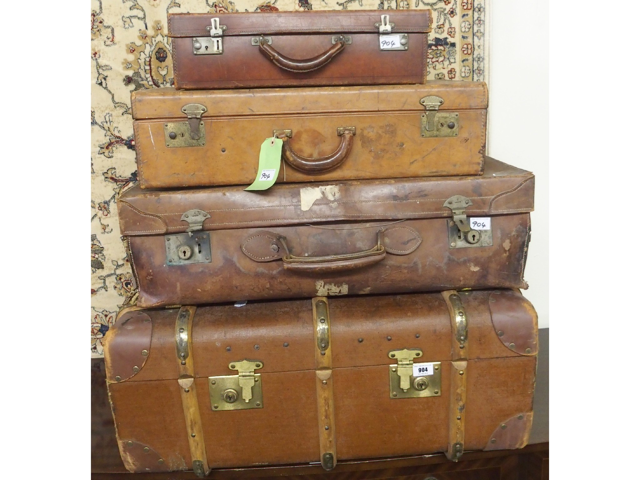 Appraisal: A wood bound trunk marked 'Canadian Pacific' and two leather