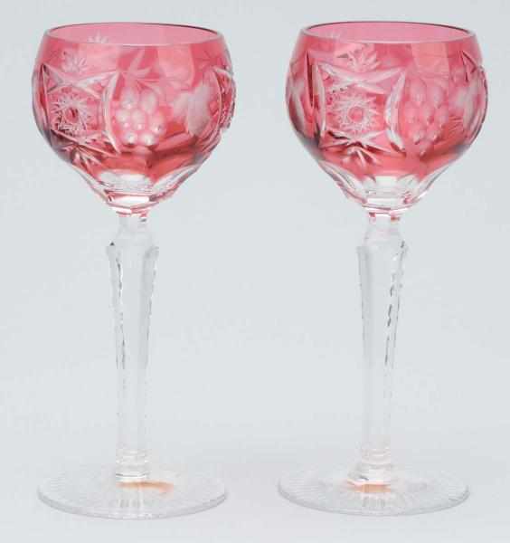 Appraisal: Pair of Vintage Cranberry Bohemian Wine Goblets Description Cranberry to