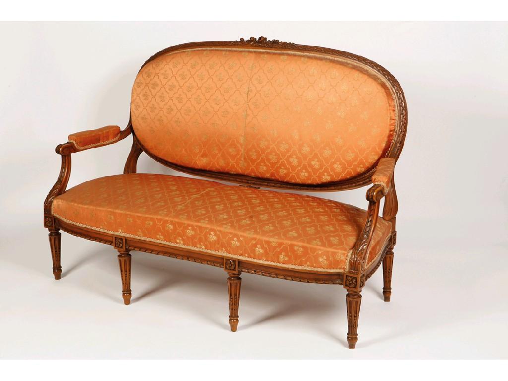 Appraisal: A LOUIS XVI STYLE THREE SEATER SOFA with upholstered back