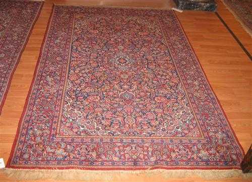 Appraisal: A PAIR OF KESHAN CARPETS old Blue central field with