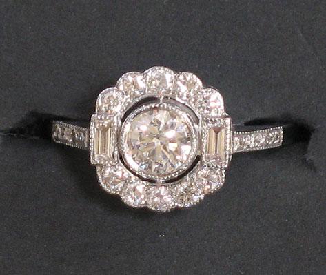 Appraisal: A DIAMOND DRESS RING in the form of a flowerhead