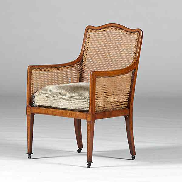 Appraisal: Regency Caned Armchair English th century A Regency enclosed armchair