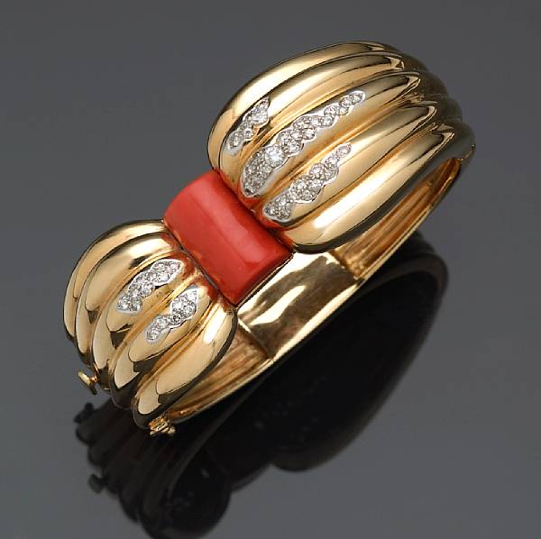 Appraisal: A diamond and coral bangle bracelet signed Limoges Jewelers estimated