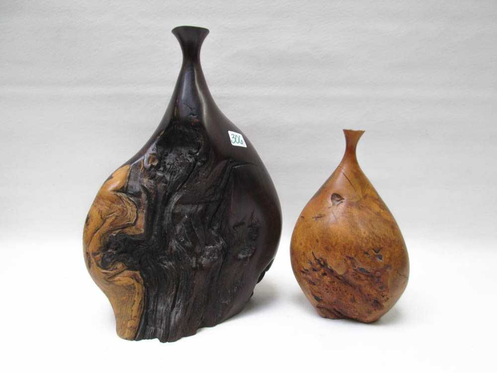 Appraisal: TWO BOB WOMACK WOOD SCULPTURES the larger desert ironwood burl