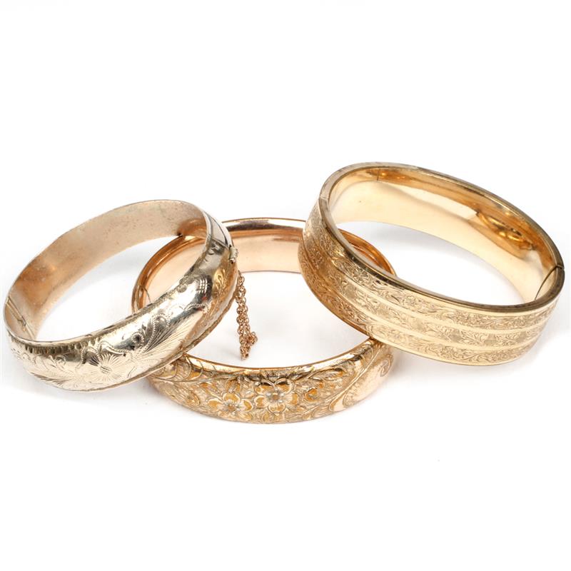 Appraisal: Three Victorian gold filled hinged bangle bracelets with chased designs