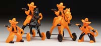 Appraisal: TWO HALLOWEEN PLASTIC COWBOYS ON HORSES AND TWO COWBOYS ON