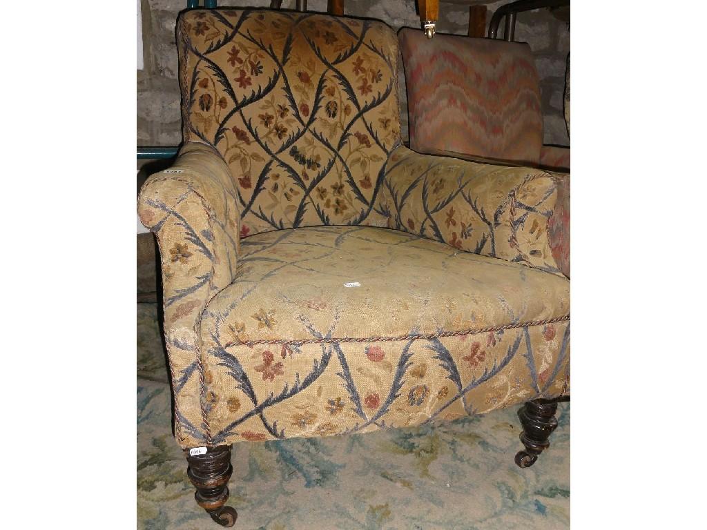 Appraisal: A late Victorian Edwardian easy chair with shaped arms and