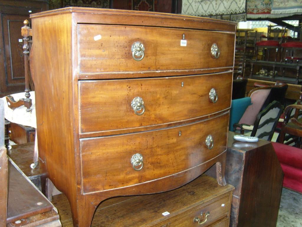 Appraisal: A Regency mahogany bow fronted chest of long graduated drawers