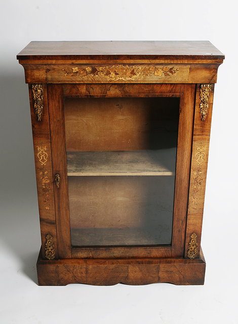 Appraisal: A VICTORIAN FIGURED WALNUT PIER CABINET with floral marquetry frieze