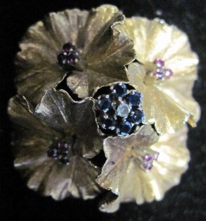 Appraisal: karat sapphire and ruby 'flower' broochFeaturing four 'blooms' accented by