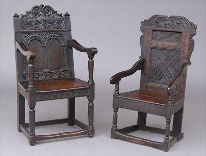 Appraisal: TWO JACOBEAN CARVED OAK WAINSCOT ARMCHAIRS Each serpentine top rail