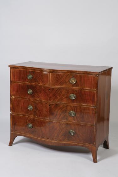 Appraisal: A GEORGE III MAHOGANY SERPENTINE FRONTED CHEST OF DRAWERS the