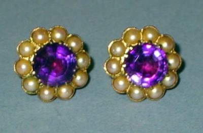 Appraisal: A PAIR OF AMETHYST AND PEARL EARRINGS the round cut