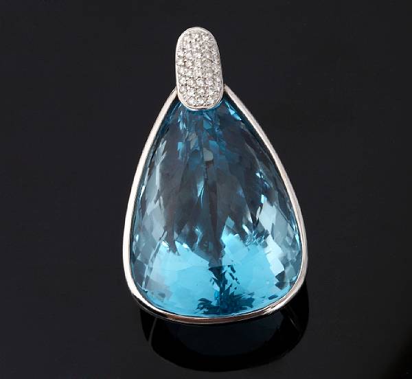 Appraisal: A blue topaz and diamond pendant the pear-shaped topaz measuring