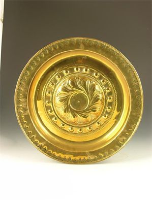 Appraisal: A th century brass alms dish with embossed and stamped