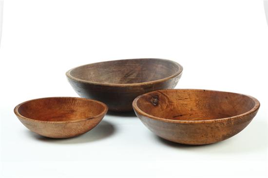 Appraisal: THREE TREENWARE BOWLS American th century maple with some figure