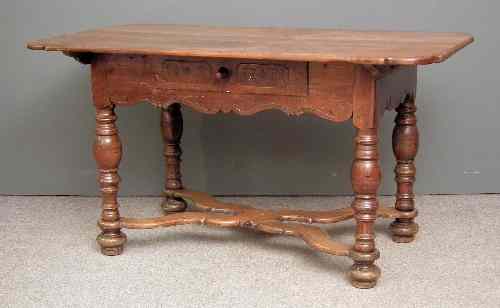 Appraisal: An th Century German fruitwood rectangular table the top with