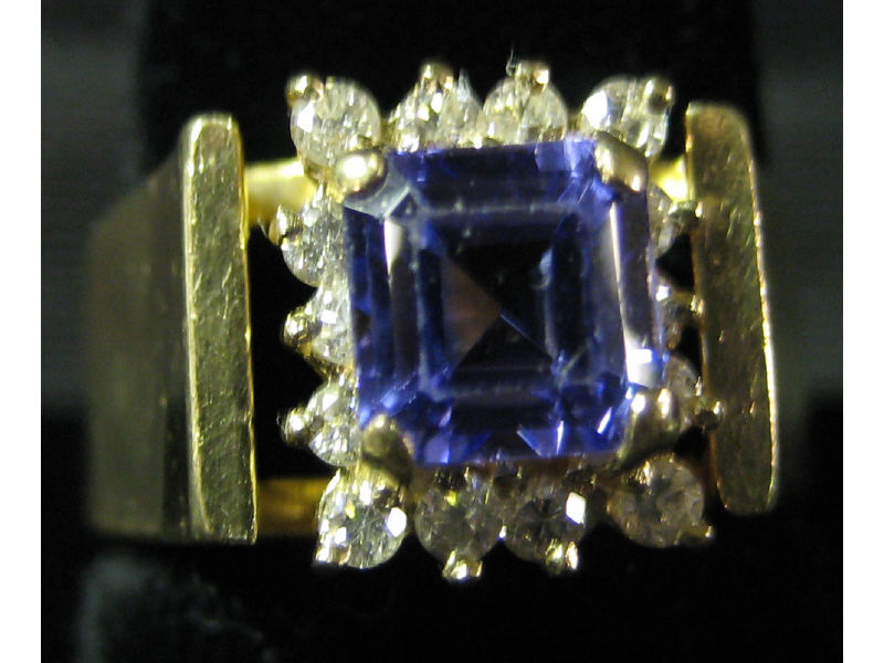 Appraisal: TANZANITE AND DIAMOND RING k yellow gold ring with one