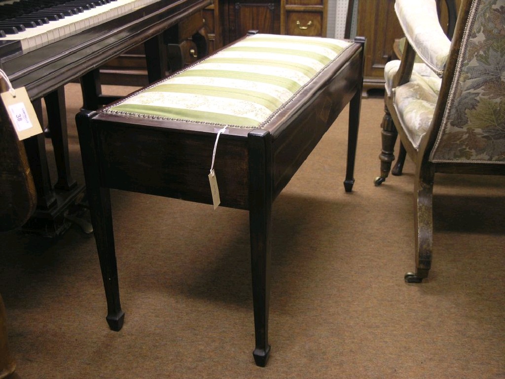 Appraisal: An inlaid mahogany pianist's duet stool hinged upholstered seat square