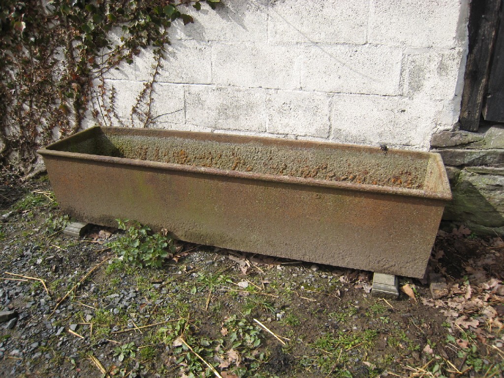 Appraisal: A large cast iron cattle Trough Planter ft W in