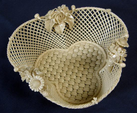 Appraisal: Belleek trefoil lattice work basket with applied floral decoration rope