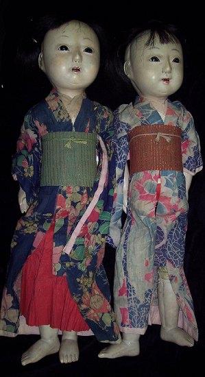 Appraisal: A pair of Japanese dolls in costumes each with fixed