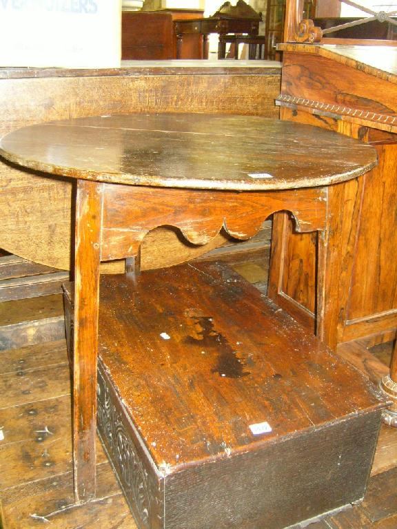 Appraisal: A Georgian oak cricket table with shaped apron