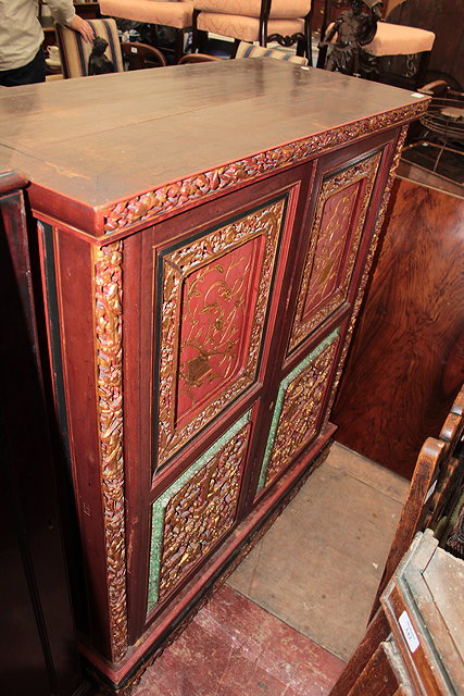 Appraisal: AN ORNATE ORIENTAL CABINET with fret carved and gilt panelled