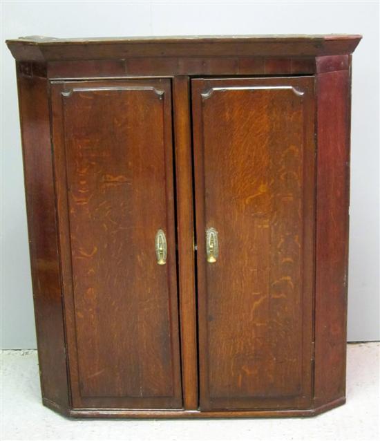 Appraisal: th century oak wall hanging corner cupboard h w d