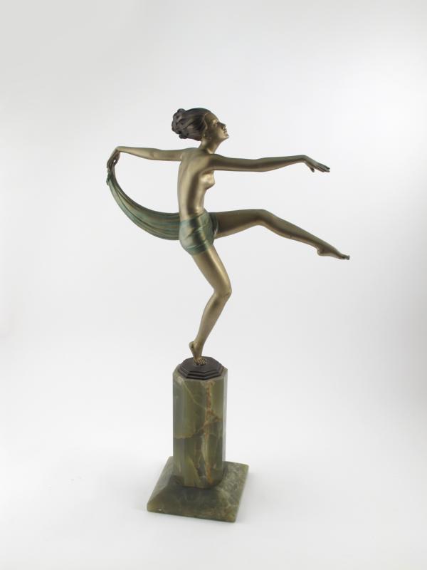 Appraisal: A tall cold-painted bronze model of a nude dancer