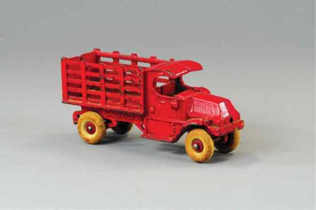 Appraisal: CHAMPION MACK STAKE TRUCK Cast iron painted in red overall