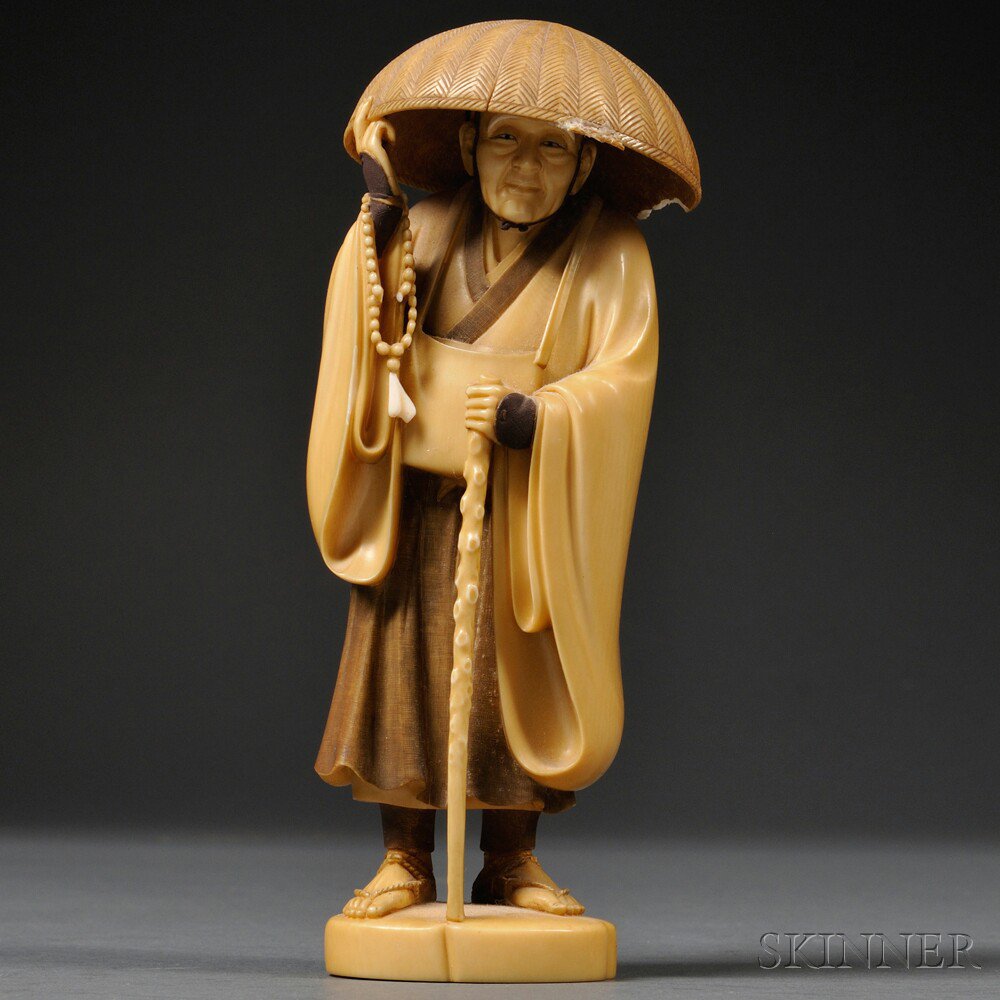 Appraisal: Ivory Carving of a Monk Japan th th century holding