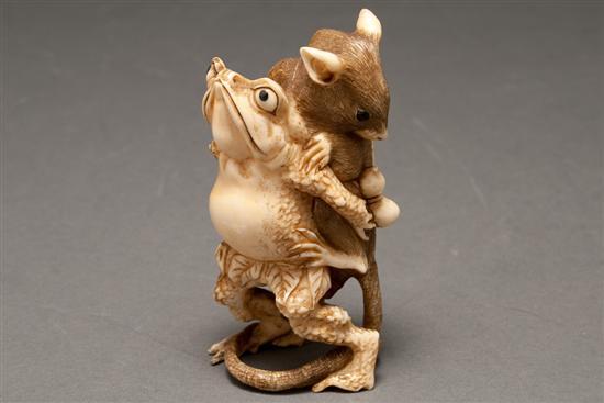 Appraisal: Japanese carved inkwash highlighted carved ivory figural group of a