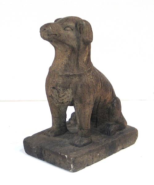 Appraisal: A carved stone model of a hound Carved in a