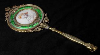 Appraisal: Gilt metal and enamel hand mirror in the Neoclassical taste