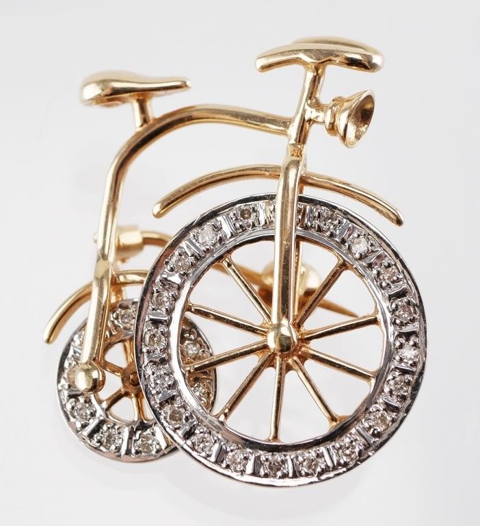 Appraisal: Bicycle brooch with diamond filled rims on rotating wheels Pin