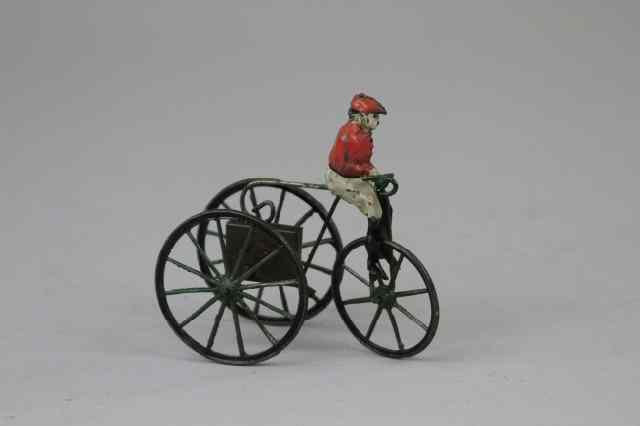 Appraisal: MAN ON THREE WHEELER France hand painted tin figure rides