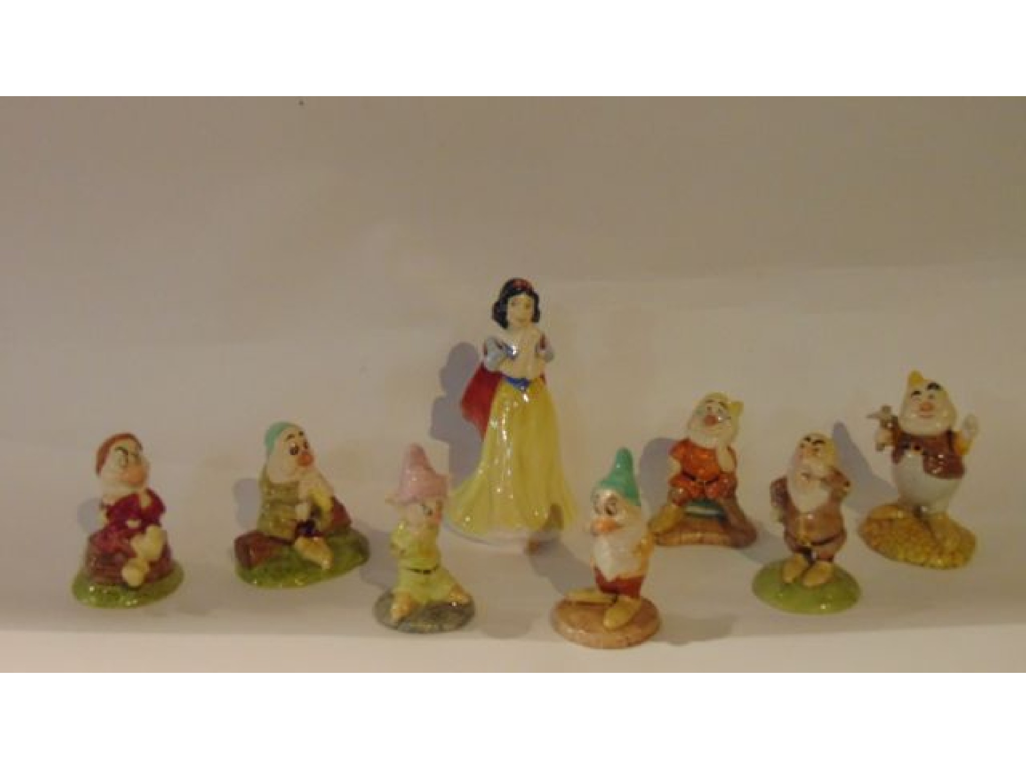 Appraisal: A set of Royal Doulton figures of Snow White and