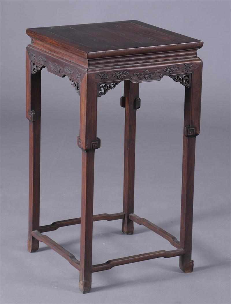 Appraisal: CHINESE CARVED HARDWOOD STAND The square top above waisted frieze