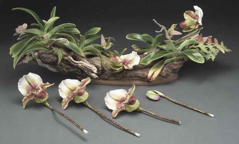 Appraisal: Boehm porcelain figure group depicting hummingbirds and orchids Marked on