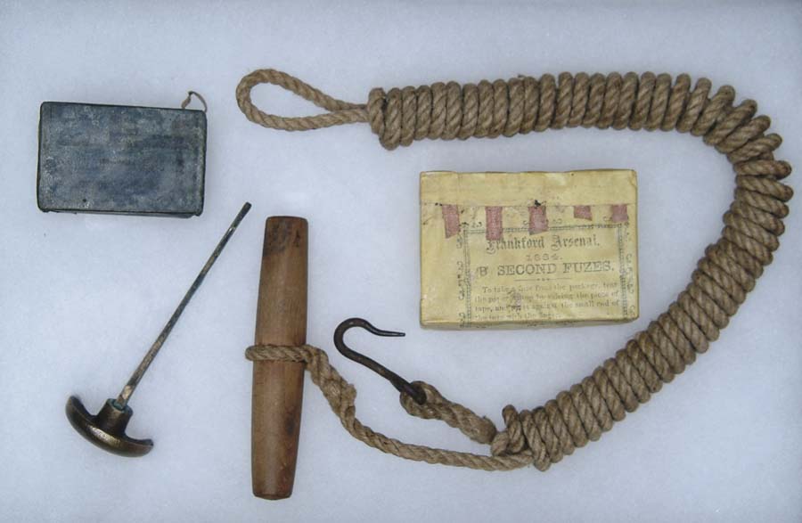 Appraisal: LOT OF FOUR ARTILLERY-RELATED ITEMS lanyard for pulling a friction