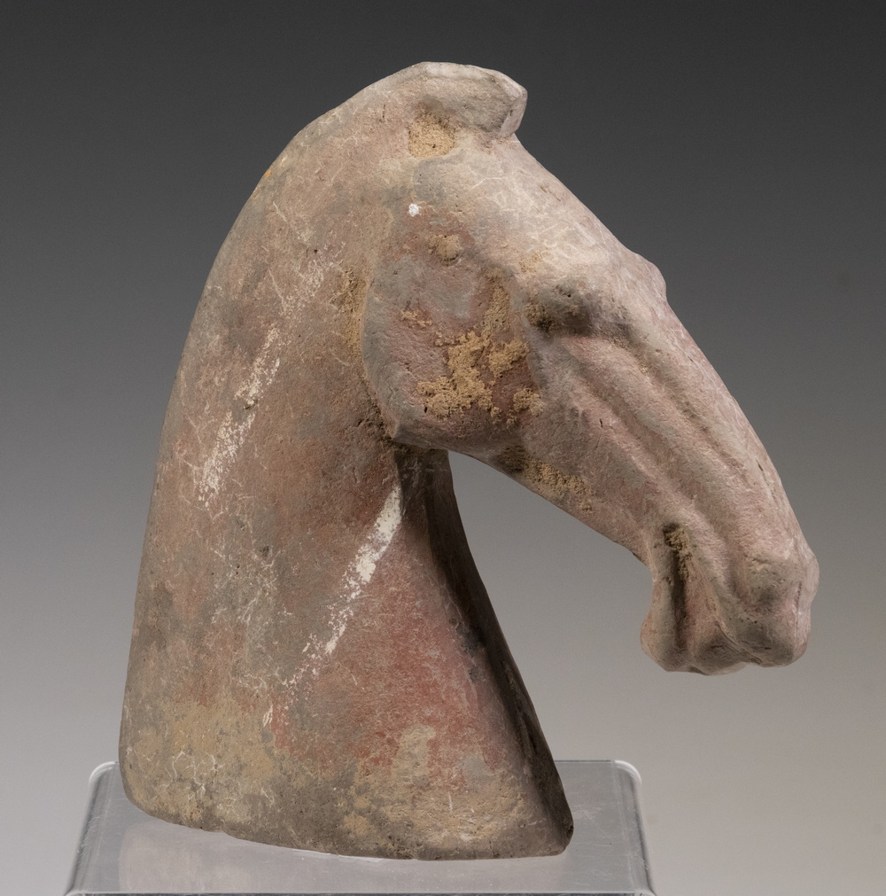 Appraisal: CHINESE HAN DYNASTY POTTERY OF A HORSE'S HEAD BC -