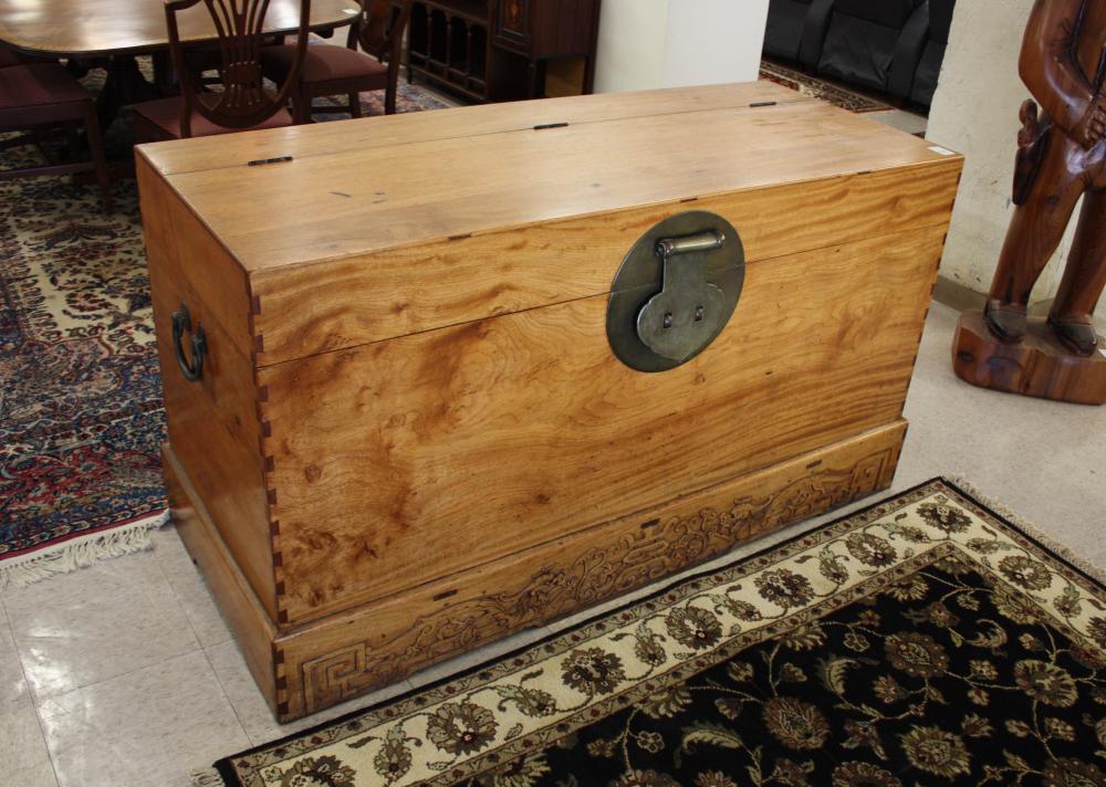 Appraisal: LARGE CHINESE LIFT-TOP STORAGE CHEST having a relief-carved base panel