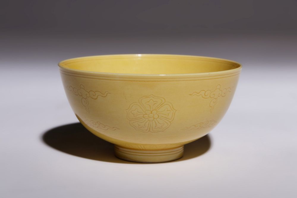 Appraisal: An Incised Yellow Glazed Porcelain Bowl Diameter in cm An