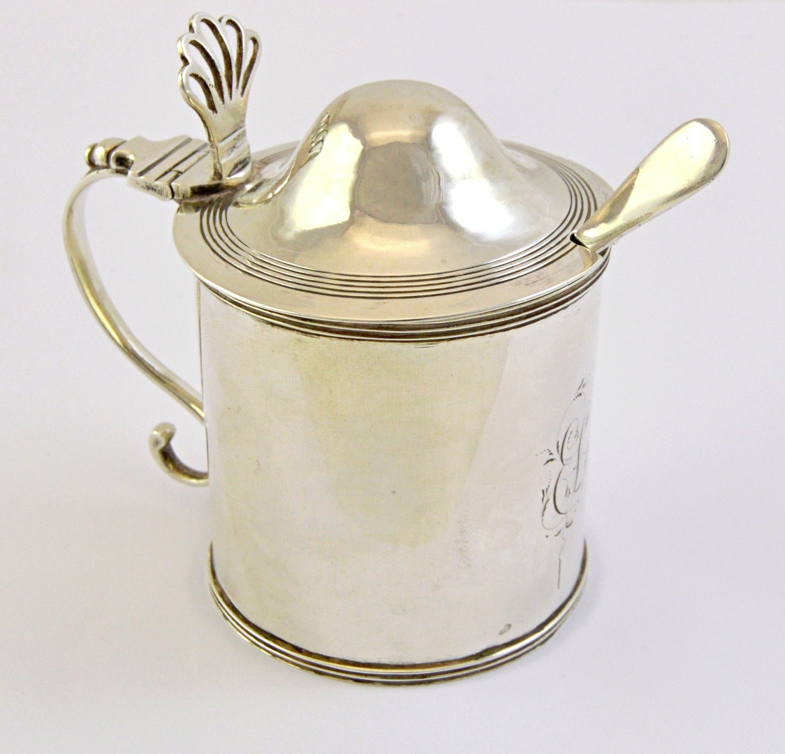 Appraisal: A George III silver mustard pot of cylindrical form decorated